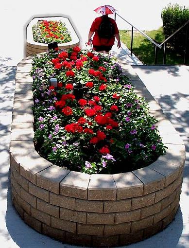 Woman Wearing Funny Hat with Flowers (a re-edit)-hospitalparkinghotday2sm.jpg