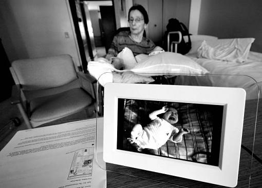 JOyce with Photo of 3 Month Hannah-magicpictureframesm.jpg