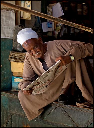 Portraits from Egypt-reading-paper-j.jpg