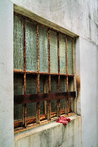 Red reg on a grungy window sill-redrag205no_wire.jpg