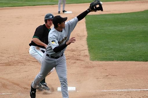 Midwest League baseball-agustin-merillo-taking-throw-third.jpg