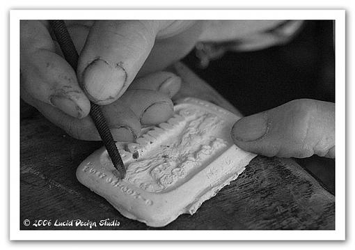 Hands of a sculptor-carving-closeup.jpg